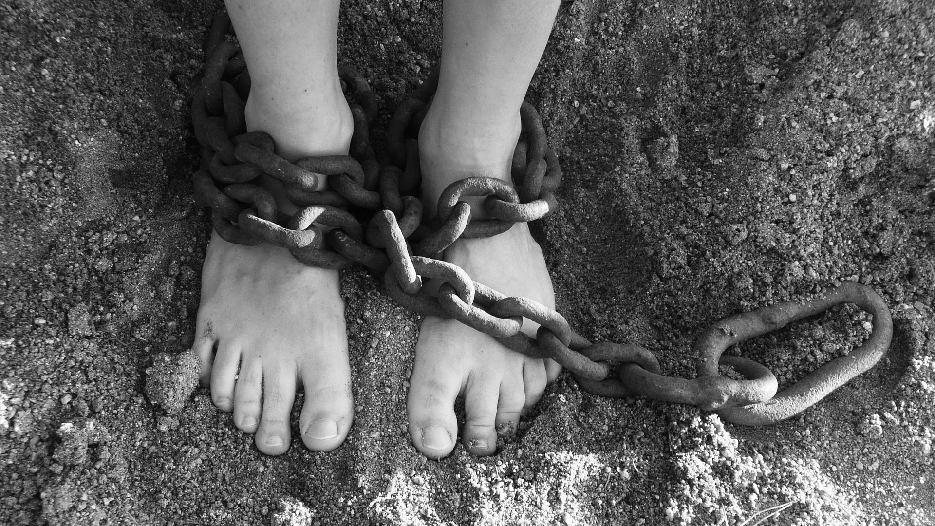 chains around person's feet