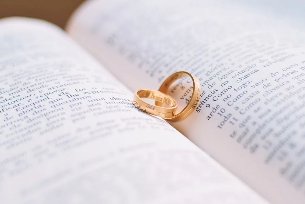marital rings on book
