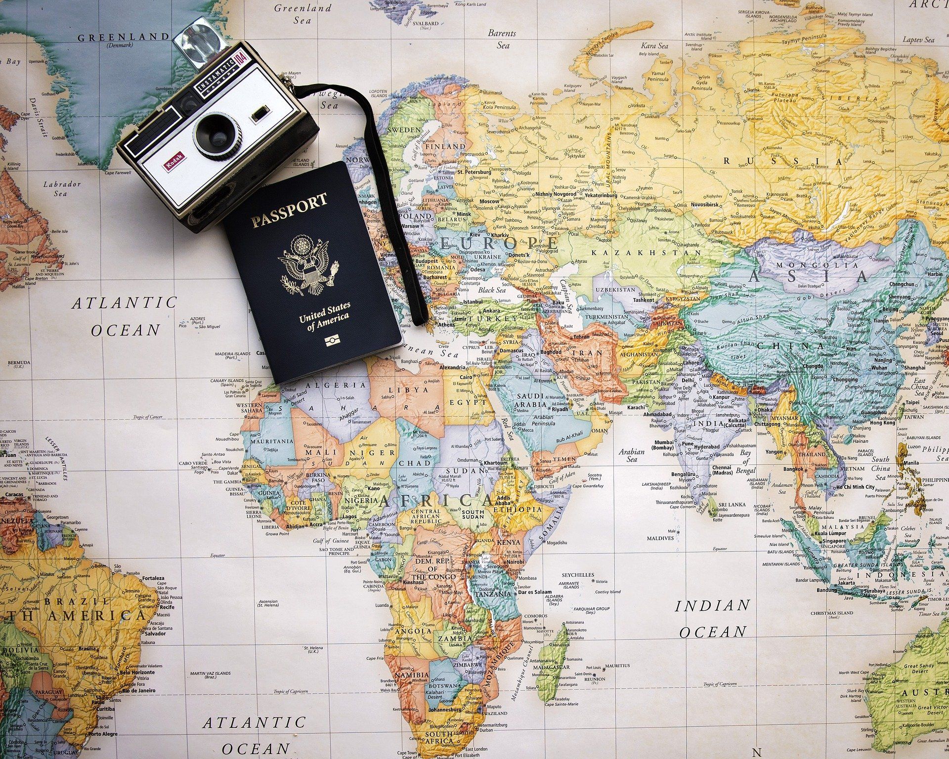 passport & camera on map
