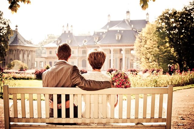couple on bench at mansion