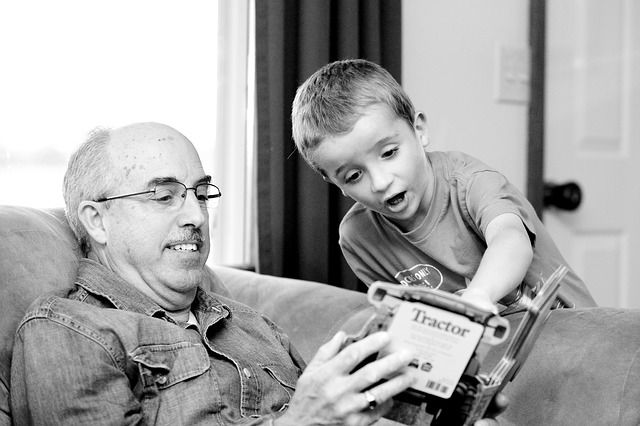 grandpa and kid reading book