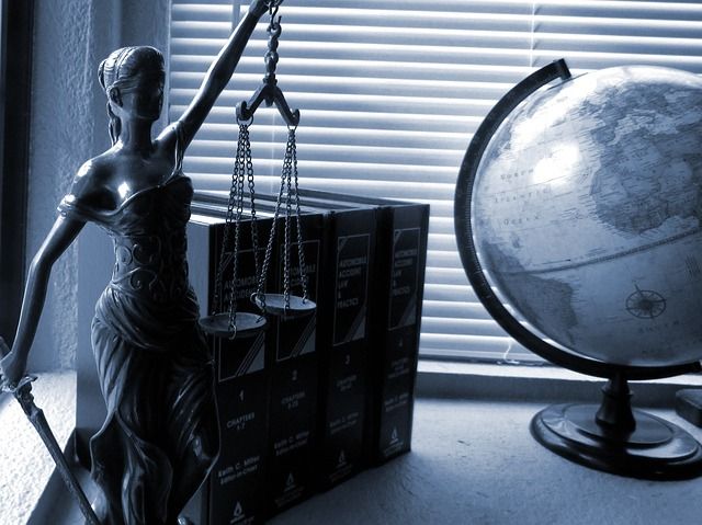 lady justice, globe, and books