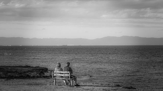 couple on bench at beach