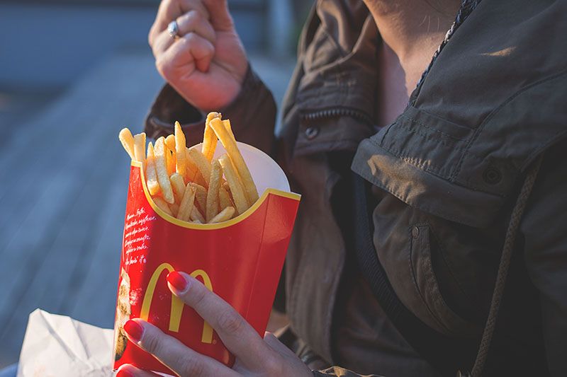 girl eating McDonald's fries